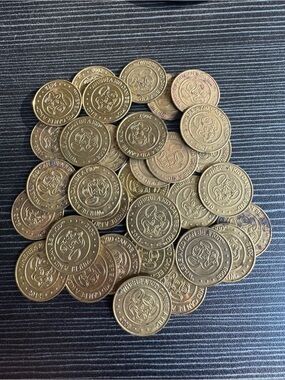 Vintage 32 Brass Chuck E Cheese Tokens. Years range from 2003-2012